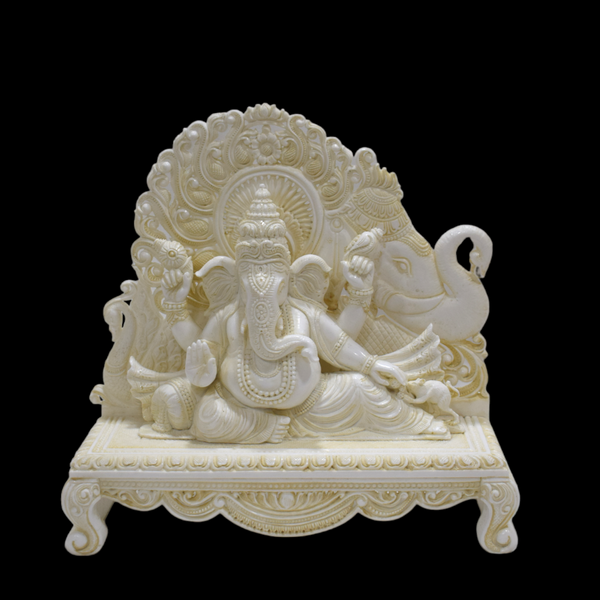 Handcrafted Faux Ivory Ganesha sitting with elephant backdrop